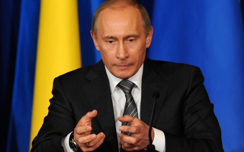 Russian Prime Minister Vladimir Putin gestures while speaking at a meeting with Ukrainian Prime Minister Yulia Tymoshchenko, not pictured, in Moscow on April 29, 2009. Ukraine's and Russia's prime ministers voiced cautious optimism that their countries' energy disputes were being resolved, after past gas cut-offs caused alarm in the EU - AFP Photo