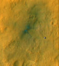 Tracks from the first drives of NASA's Mars rover Curiosity are visible in this image captured by the Mars Reconnaissance Orbiter. The rover is seen where the tracks end. The image's color has been enhanced to show the surface details better. I