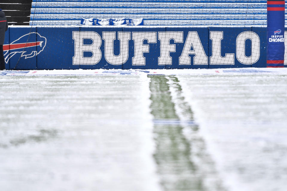 FILE - Snow covers the field at Highmark Stadium before an NFL football game between the Atlanta Falcons and Buffalo Bills in Orchard Park, N.Y., on Sunday, Jan. 2, 2022. The NFL is monitoring the weather and has contingency plans in place in the event a lake-effect snowstorm hitting the Buffalo disrupts the Bills ability to host the Cleveland Browns on Sunday, Nov. 20, 2022. (AP Photo/Adrian Kraus, File)