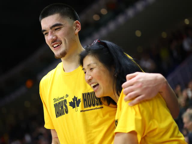 <p>Vaughn Ridley/Getty</p> Zach Edey and his mother Julia following a Discount Tire Hall of Fame Series game against the Alabama Crimson Tide on December 09, 2023 in Toronto, Ontario, Canada.