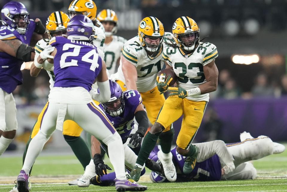 Green Bay Packers' Aaron Jones runs during the second half of an NFL football game against the Minnesota Vikings Sunday, Dec. 31, 2023, in Minneapolis. (AP Photo/Abbie Parr)