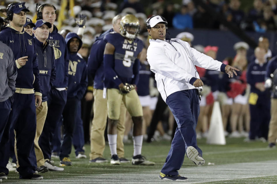 FILE - In this Oct. 22, 2016, file photo, Navy head coach Ken Niumatalolo, right, reacts as he watches a failed field goal-attempt in the second half of an NCAA college football game against Memphis, in Annapolis, Md. The 120th Army-Navy game is set for Saturday in Philadelphia. Navy leads the series 60-52-7. (AP Photo/Patrick Semansky, File)