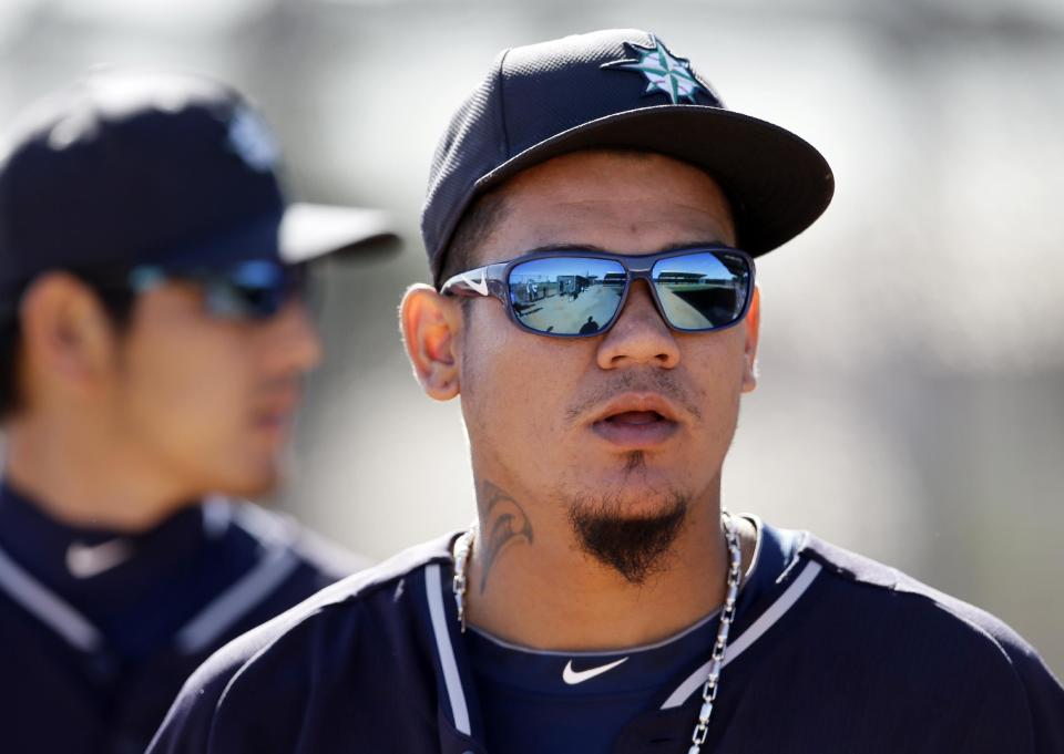 Seattle Mariners' Felix Hernandez walks out of the bullpen after a throwing session during spring training baseball practice, Thursday Feb. 20, 2014, in Peoria, Ariz. (AP Photo/Tony Gutierrez)