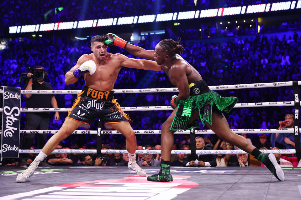 MANCHESTER, ENGLAND - OCTOBER 14: KSI (Olajide Olayinka Williams) and Tommy Fury exchange punches during the Misfits Cruiserweight fight between KSI (Olajide Olayinka Williams) and Tommy Fury at AO Arena on October 14, 2023 in Manchester, England. (Photo by Matt McNulty/Getty Images)