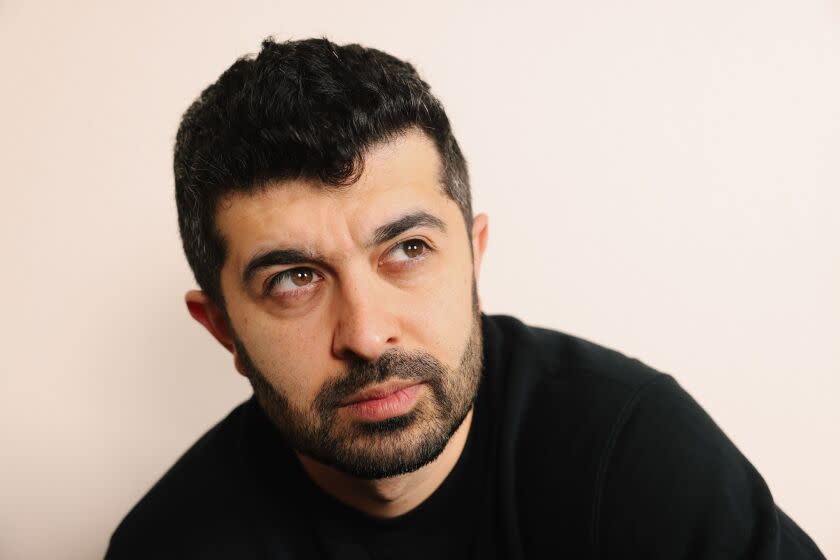 Los Angeles, CA - March 22: Actor Behzad Dabu, who runs the Hillman Grad's actor mentorship program, poses for a portrait at his apartment on Wednesday, March 22, 2023 in Los Angeles, CA. He says that success to him is being financially independent doing creative and acting work. (Dania Maxwell / Los Angeles Times).