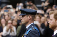 <p>Britain's William, Prince of Wales and Britain's Prince Harry, Duke of Sussex, stand as the funeral procession marches down The Mall, on the day of the state funeral and burial of Britain's Queen Elizabeth, in London, Britain, September 19, 2022 REUTERS/Peter Cziborra</p> 