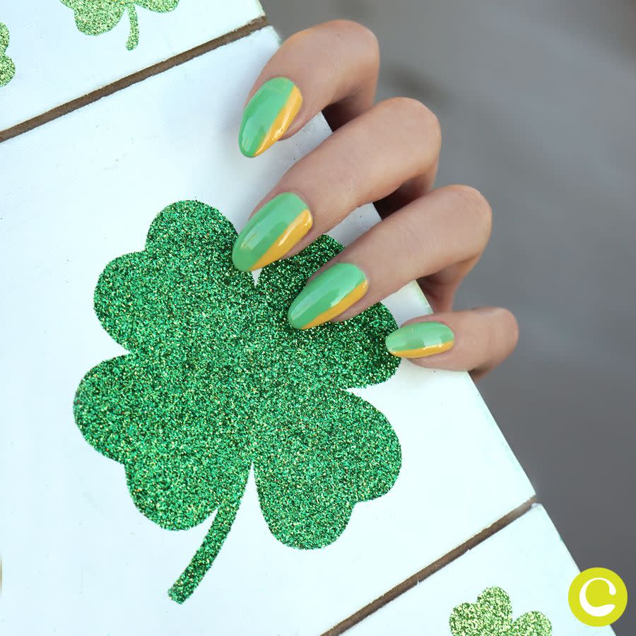 female hands with a green and gold manicure for the st patricks day holiday