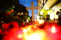 <p>A cross, candles and flowers are seen at the crime scene where a German man was stabbed in Chemnitz, Germany, Aug. 31, 2018. (Photo: Hannibal Hanschke/Reuters) </p>