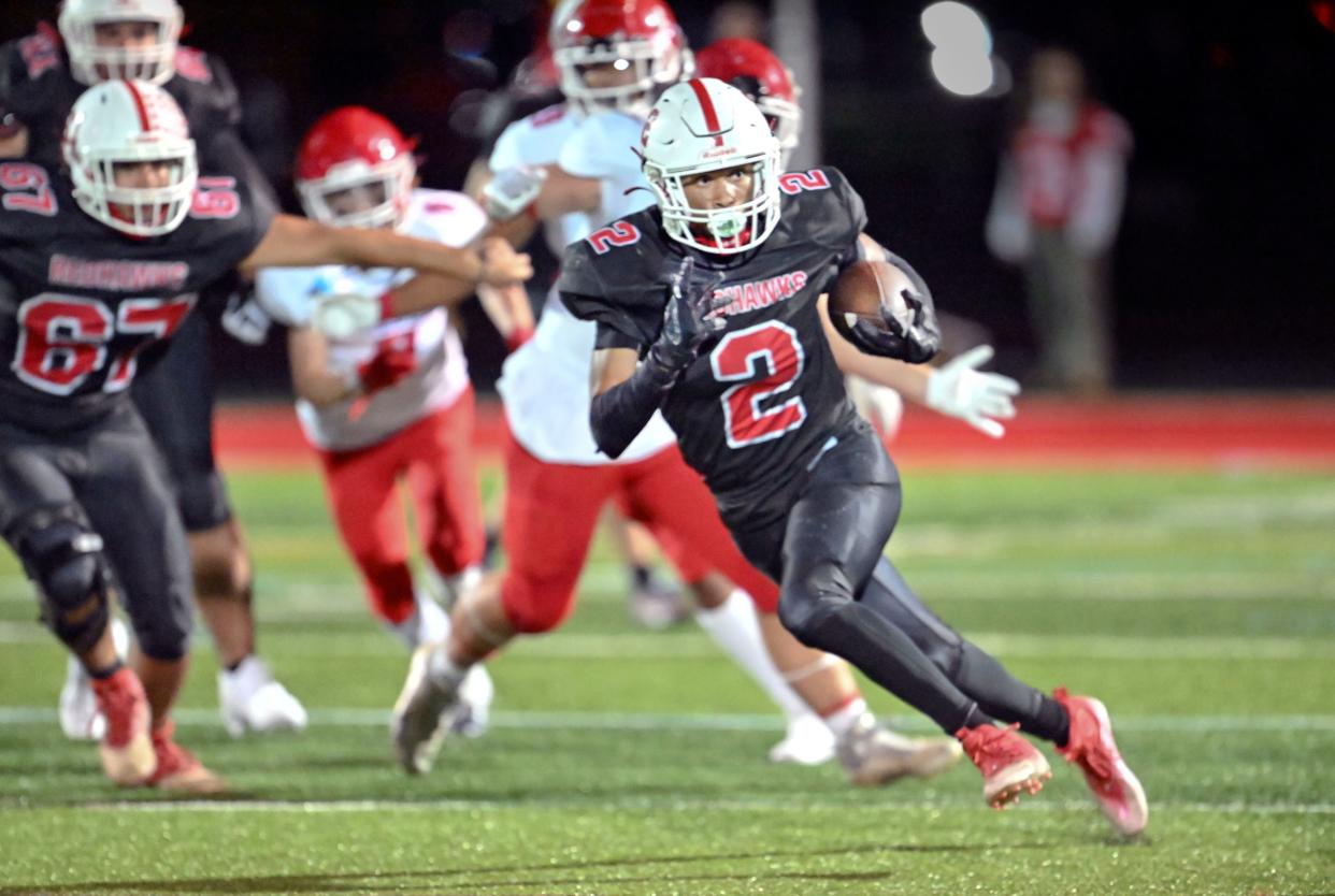 Tajardo France of Barnstable breaks away from the Bridgewater-Raynham defense for a long touchdown run.