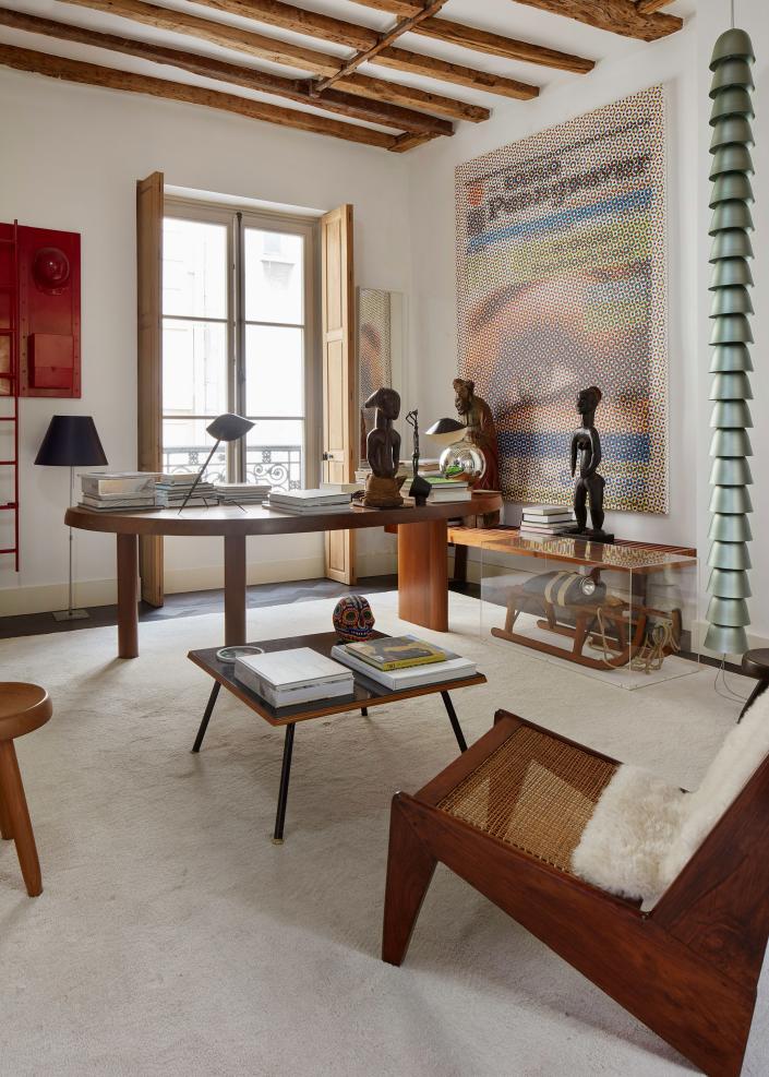 In Laffanour&apos;s second-floor office, the desk is a table by Charlotte Perriand, and other works are by Jean-Pierre Reynaud, Mungo Thomson, Joseph Beuys, Pierre Jeanneret, and Ronan and Erwan Bouroullec.