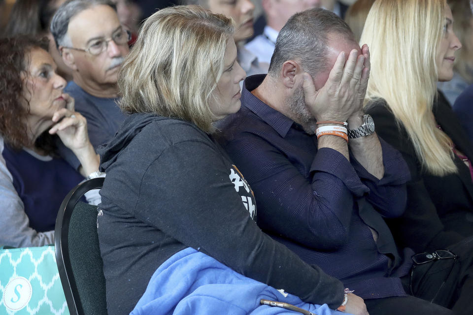 FILE - Jennifer and Fred Guttenberg, parents of shooting victim Jaime Guttenberg watch videos from the school shooting during the Marjory Stoneman Douglas High School Public Safety Commission meeting Thursday, Nov. 15, 2018. (Mike Stocker/South Florida Sun-Sentinel via AP, Pool, File)