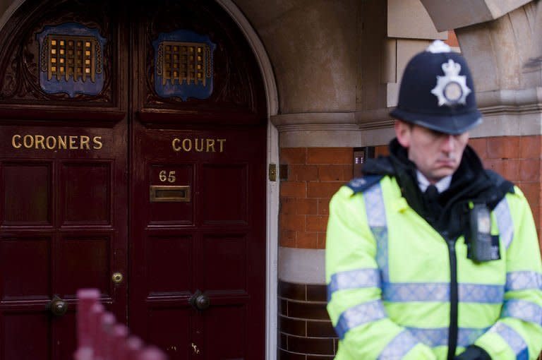 A police officer stands outside Westminster coroners court in central London on December 13, 2012, ahead of the inquest into the death of Jacinda Saldanha. Death threats have been made against the Australian radio hosts involved in the royal prank call tragedy, police said, with station management reportedly moving some staff to safehouses