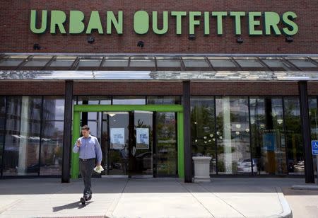 A customer leaves the Urban Outfitters store in Denver May 14, 2015. REUTERS/Rick Wilking