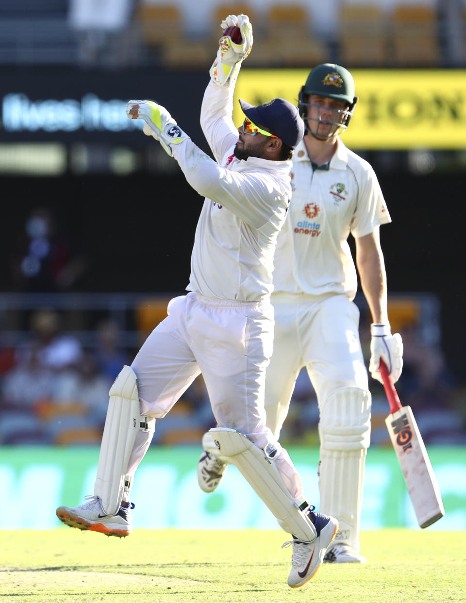 India's wicketkeeper Rishabh Pant catches the ball during play on the first day of the fourth cricket test between India and Australia at the Gabba, Brisbane, Australia, Friday, Jan. 15, 2021. (AP Photo/Tertius Pickard)