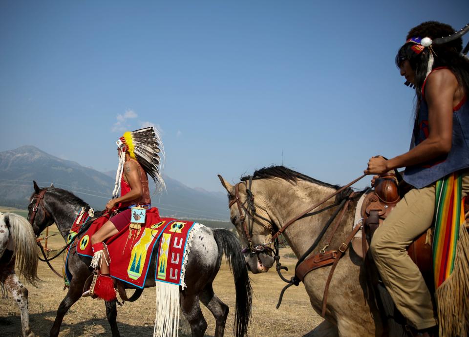 Members of the Nez Perce Tribe ride on Am’sáaxpa or "the place of boulders," for a land blessing ceremony on Thursday, July 29, 2021 in Joseph, Ore. The tribe purchased 148 acres of ancestral land in December 2020, over a century after being pushed out of the area.