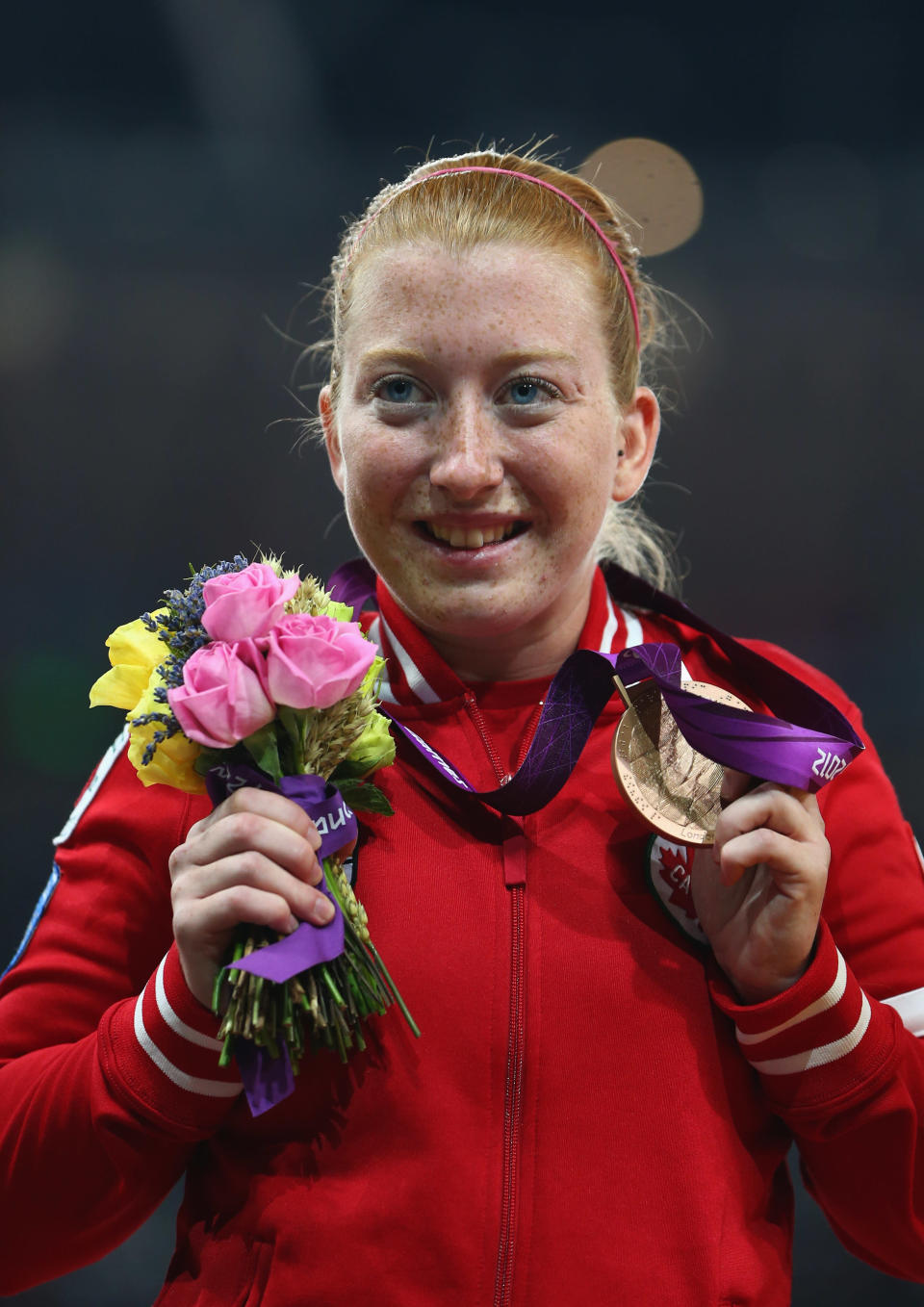LONDON, ENGLAND - AUGUST 31: Bronze medalist Virginia Mclachlan of Canada poses on the podium during the medal ceremony in the Women's 200m - T35 Final on day 2 of the London 2012 Paralympic Games at Olympic Stadium on August 31, 2012 in London, England. (Photo by Michael Steele/Getty Images)