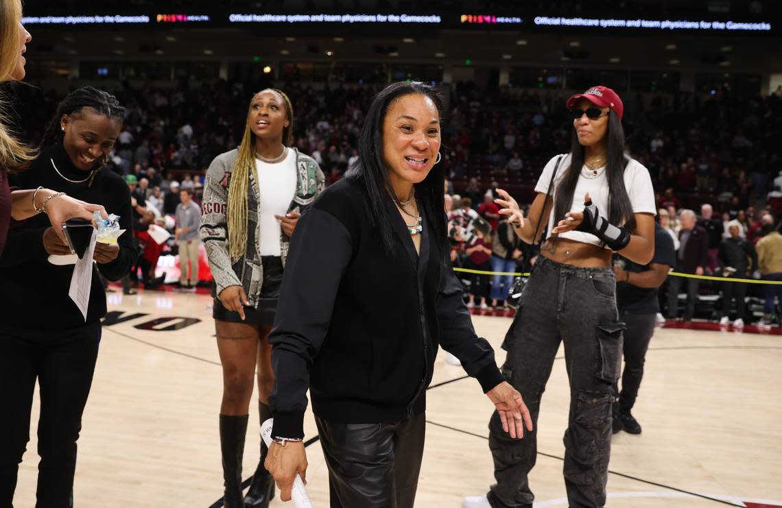 South Carolina head coach Dawn Staley laughs with former players A’ja Wilson and Tiffany Mitchell following the Gamecocks’ game against the visiting Terrapins at Colonial Life Arena on Sunday, November 12, 2023.