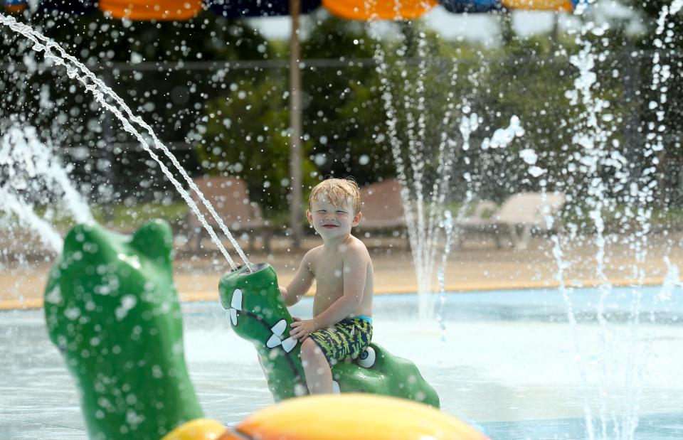 Grayson Hardin plays in the water at the Harrison Taylor Splash Pad in Palmore Park in Tuscaloosa Thursday, June 4, 2020. [Staff Photo/Gary Cosby Jr.]