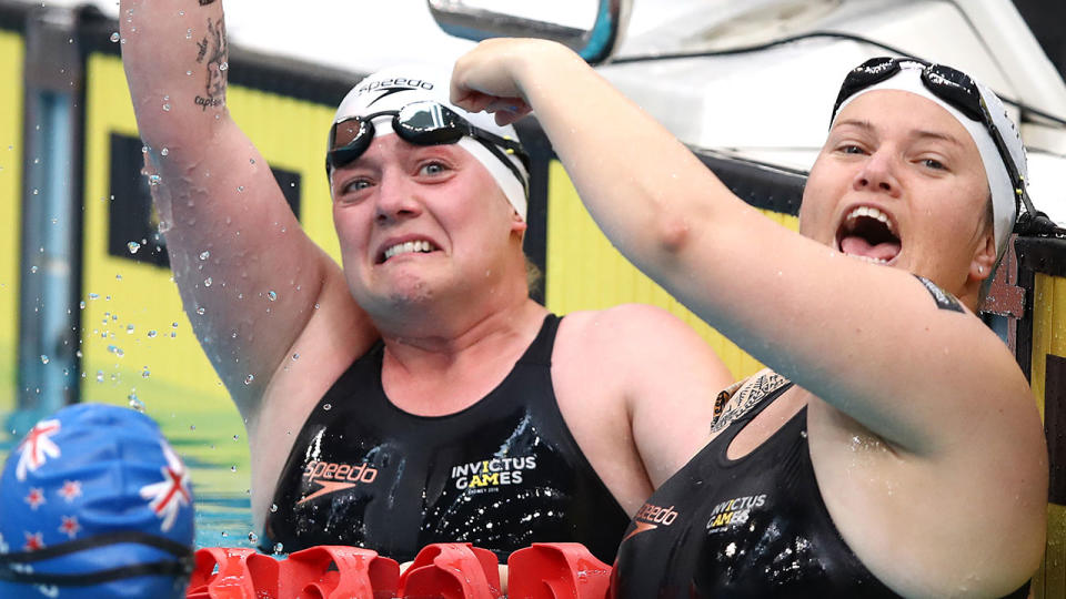 Sarah Robinson of United Kingdom celebrates in the Women’s 50m Freestyle ISD Swimming Heats during day four of the Invictus Games Sydney 2018, with Poppy Pawsey by her side. Pic: Getty