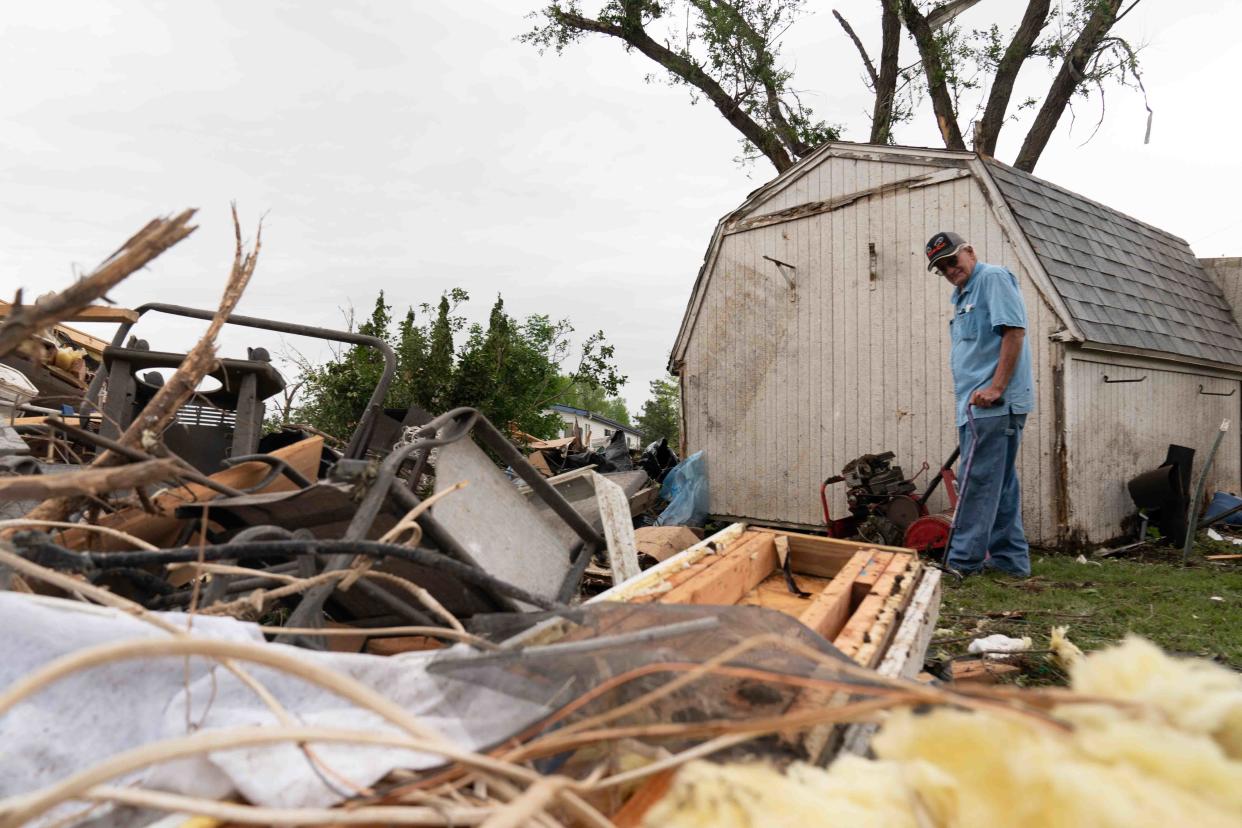 Barry Toburen looks over the scattered debris from his home at 406 Scott Drive in Westmoreland on Wednesday morning. Toburen's home was destroyed Tuesday evening by a tornado that ripped through the town, killing one and destroying multiple homes and buildings.