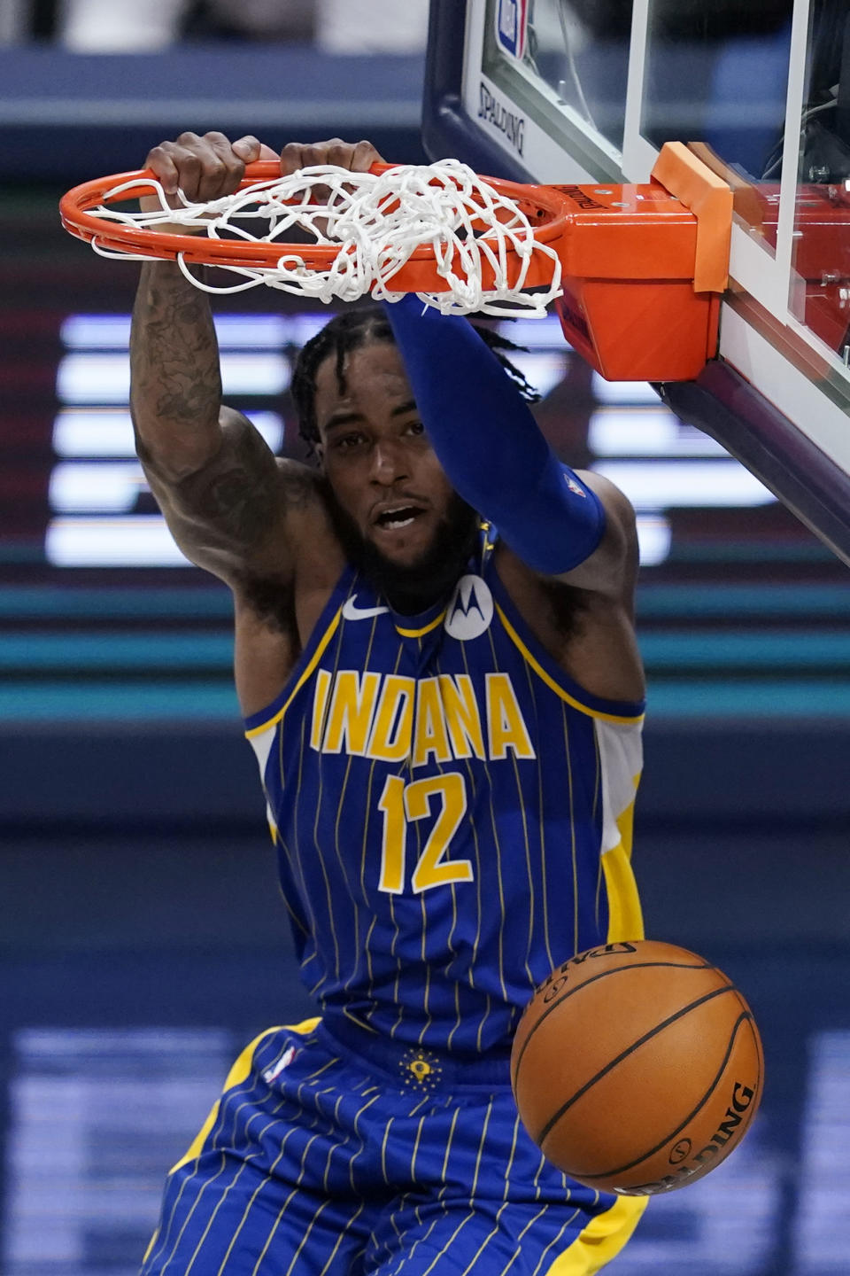 Indiana Pacers' Oshae Brissett dunks during the second half of the team's NBA basketball Eastern Conference play-in game against the Charlotte Hornets, Tuesday, May 18, 2021, in Indianapolis. (AP Photo/Darron Cummings)