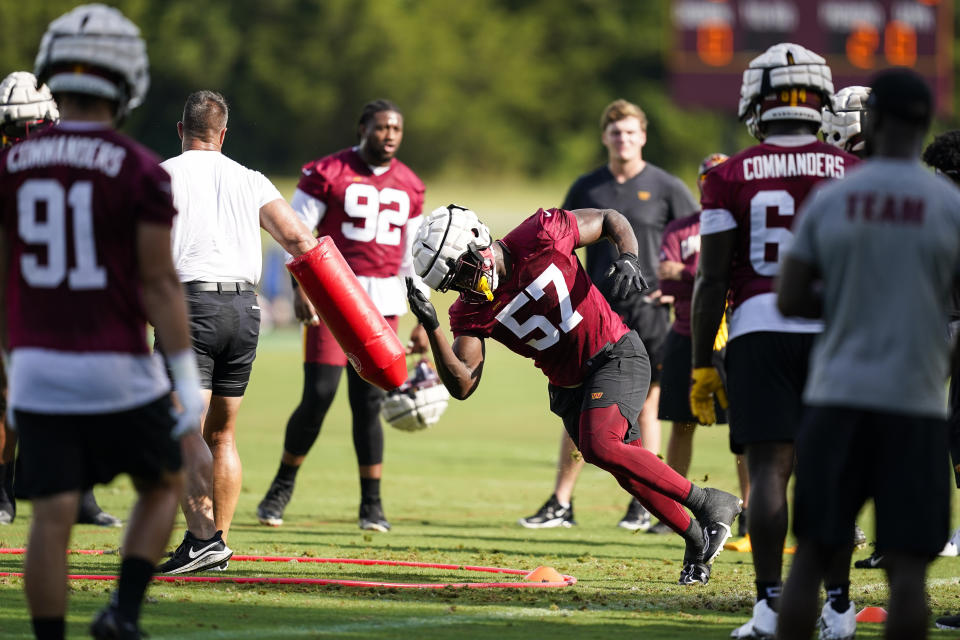 Washington Commanders defensive end Bunmi Rotimi (57) runs a drill during NFL football training camp, Thursday, July 28, 2022 in Ashburn, Va. (AP Photo/Alex Brandon)