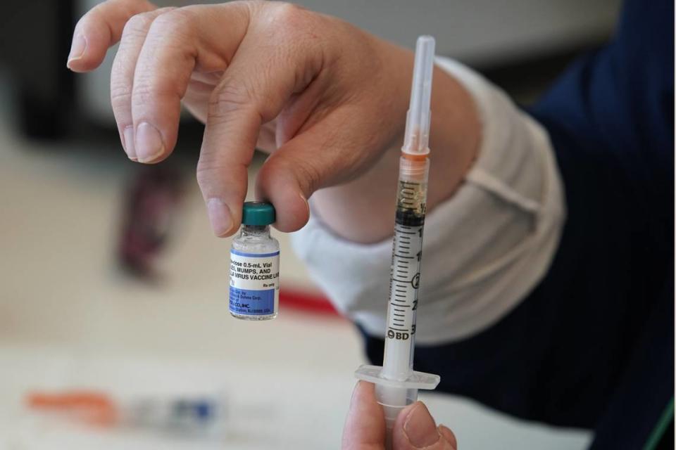 Measles Vaccine. A nurse holds up a one dose bottle and a prepared syringe of measles, mumps and rubella virus vaccine made by Merck at the Utah County Health Department on April 29, 2019 in Provo, Utah. Two measles cases have been reported in Northern California in March 2024.