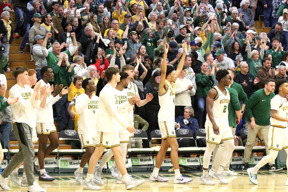 The Vermont men's basketball bench celebrates after the final buzzer of its 75-72 America East quarterfinal win over Albany at Patrick Gym on Saturday, March 9, 2024.