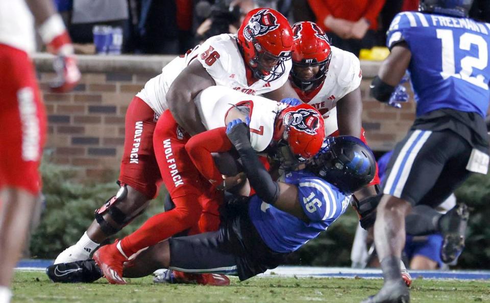 DUPLICATE***N.C. State quarterback MJ Morris (7) is sacked by Duke defensive tackle Aeneas Peebles (16) during the first half of N.C. State’s game against Duke at Wallace Wade Stadium in Durham, N.C., Saturday, Oct. 14, 2023.