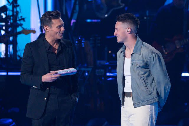 <p>Eric McCandless/Disney</p> Ryan Seacrest and Jack Blocker on 'American Idol.'