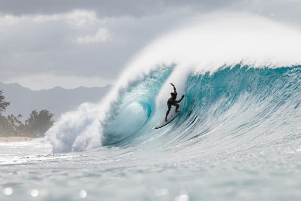 There’s lots of sand built up at Gum–the patch of beach directly to the right of Pipeline (if you're looking at the wave straight on)–and this causes a lot of imperfections in the waves. Here, Eala Stewart navigates the airdrop as the wave lurches up on the first reef of Pipeline.<p>Ryan "Chachi" Craig</p>