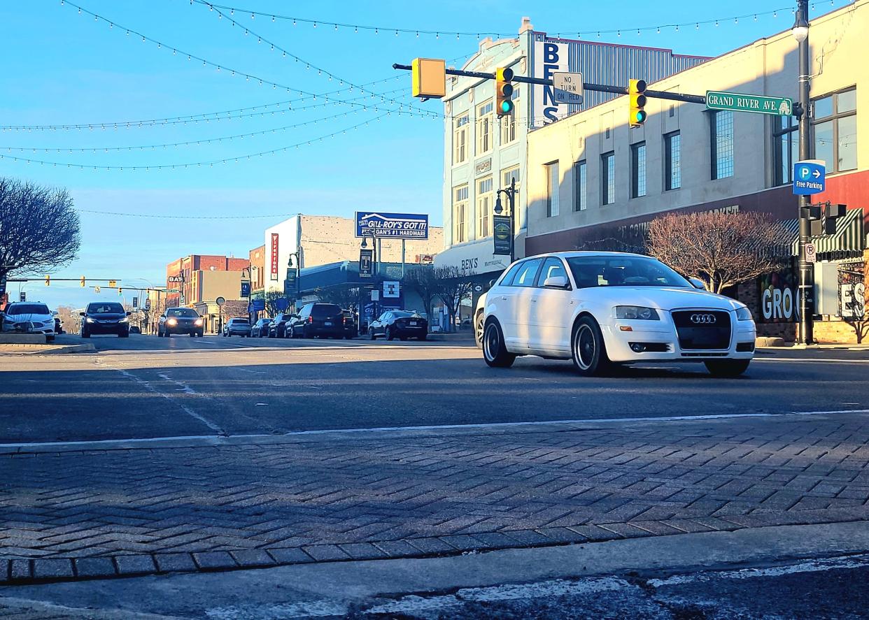 Cars travel south through downtown Port Huron on Thursday, Feb. 29, 2024, on Huron Avenue. Part of a state throughway, the Michigan Department of Transportation will reconstruct the roadway from the Military Street Bridge to Glenwood Avenue in 2026.