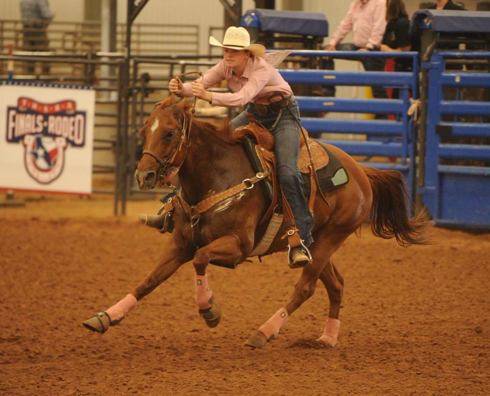 Uvalde's McKenzie Speer competes in barrel racing at the Texas High School Finals Rodeo at Taylor Telecom Arena in Abilene on Friday.