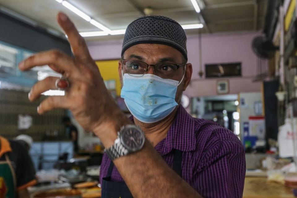 Haja Noodhin speaks to Malay Mail during an interview at Restoran Kudu bin Abdul in Kuala Lumpur June 14, 2021. — Picture by Yusof Mat Isa