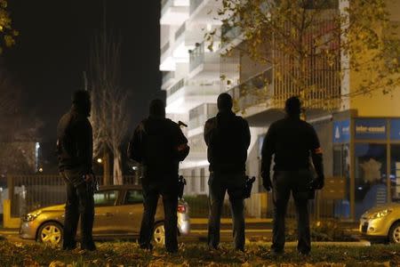 French police secure the area outside a housing complex as police conduct a door-to-door search operation in the Neudorf neighborhood in Strasbourg, France, November 16, 2015. REUTERS/Vincent Kessler