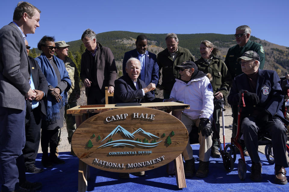 FILE - President Joe Biden reacts after signing a proclamation to designate the first national monument of his administration at Camp Hale, a World War II-era training site, near Leadville, Colo., Wednesday, Oct. 12, 2022. The location is an alpine training site where U.S. soldiers prepared for battles in the Italian Alps during World War II. (AP Photo/Carolyn Kaster, File)