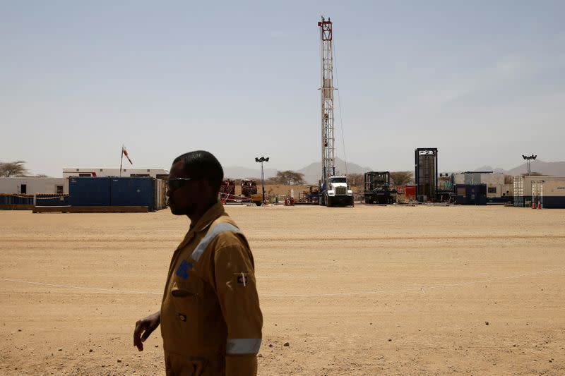 FILE PHOTO: Worker walks at a Tullow Oil explorational drilling site in Lokichar