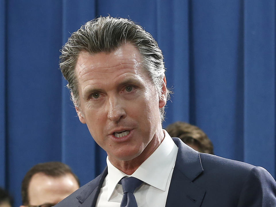 In this Monday April 29, 2019 photo, Gov. Gavin Newsom talks to reporters at the Capitol in Sacramento, Calif. Newsom officially abandoned the plan of his predecessor, Gov. Jerry Brown, to build giant 35-mile twin tunnels to ship water through the Sacramento-San Joaquin River Delta to Southern California, Thursday, May 2, 2019. Instead Newsom is opting to build a single tunnel with a different design and a lower price. (AP Photo/Rich Pedroncelli)