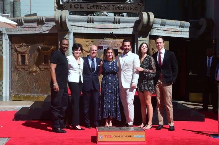 Hollywood producer Jeffrey Katzenberg(3rdL) is joined by actors Eddie Murphy(L) and Jim Parsons(R) while posing with his family at his Hand and Footprints ceremony in front of the TCL Chinese Theater