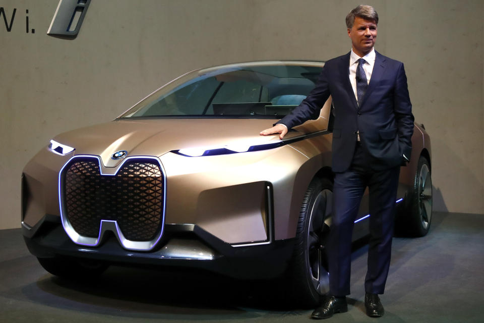 CEO of the German car manufacturer BMW, Harald Krueger, poses at a BMWi car prior to the earnings press conference in Munich, Germany, Wednesday, March 20, 2019. (AP Photo/Matthias Schrader)