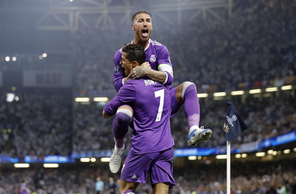 <p>Real Madrid’s Cristiano Ronaldo celebrates scoring their first goal with Sergio Ramos </p>