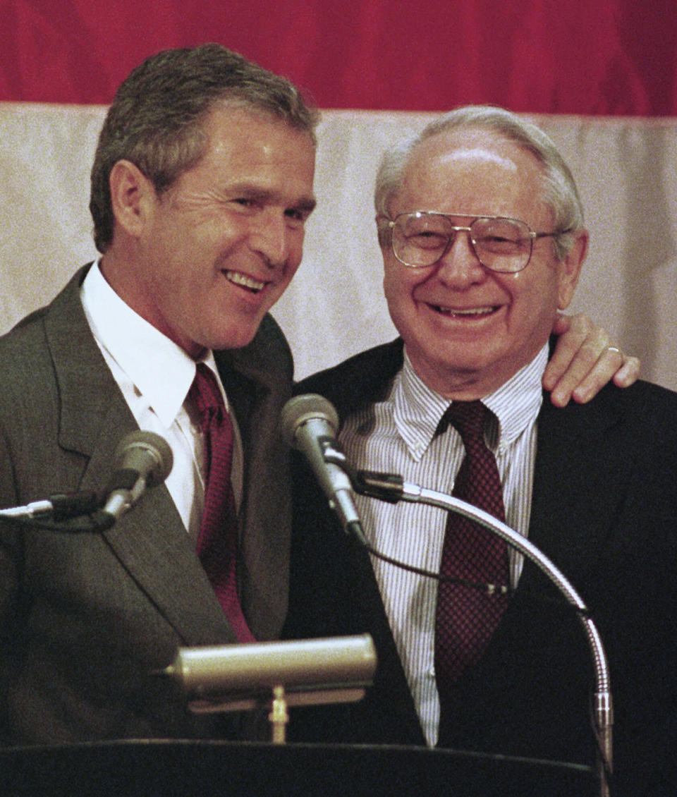 FILE - Texas Gov. George Bush, left, hugs North Carolina Sen. Lauch Faircloth (R-N.C., during a luncheon in Greensboro, N.C., Thursday June 18, 1998. Former U.S. Sen. Lauch Faircloth of North Carolina, a onetime conservative Democrat who switched late in his career to the Republicans and then got elected to Congress, died Thursday, Sept. 14, 2023. He was 95.(AP Photo/Chuck Burton, File)