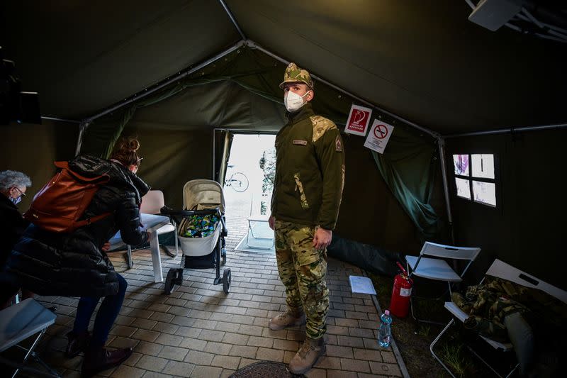 Hungarian epee world champion Gergely Siklosi stands as he volunteers at a vaccination centre in Budapest