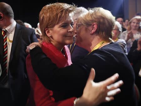 Party leader Nicola Sturgeon, hugs her mother Joan after speaking at the Scottish National Party's conference in Aberdeen, Scotland, Britain March 18, 2017. REUTERS/Russell Cheyne