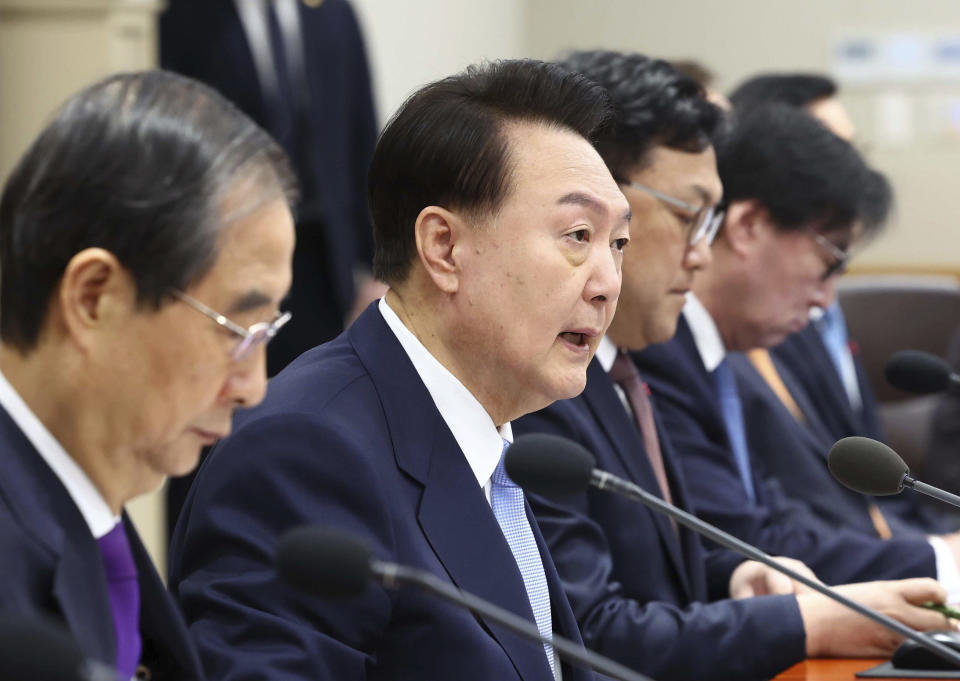 South Korean President Yoon Suk Yeol, center, speaks during a Cabinet Council meeting at the presidential office in Seoul, South Korea, Tuesday, Dec. 19, 2023. Yoon said during the meeting on Tuesday that a “nuclear-based, powerful Korea-U.S. alliance” would be formed soon. (Yonhap via AP)