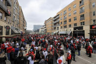 Fans gather outside the ballpark prior to the baseball game between the St. Louis Cardinals and the Cincinnati Reds in Cincinnati, Thursday, April 1, 2021. (AP Photo/Aaron Doster)