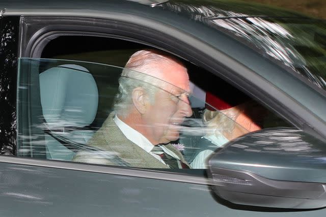 <p>Peter Jolly/Shutterstock</p> King Charles and Queen Camilla drive to Crathie Church in Scotland near Balmoral Castle on Aug. 13.