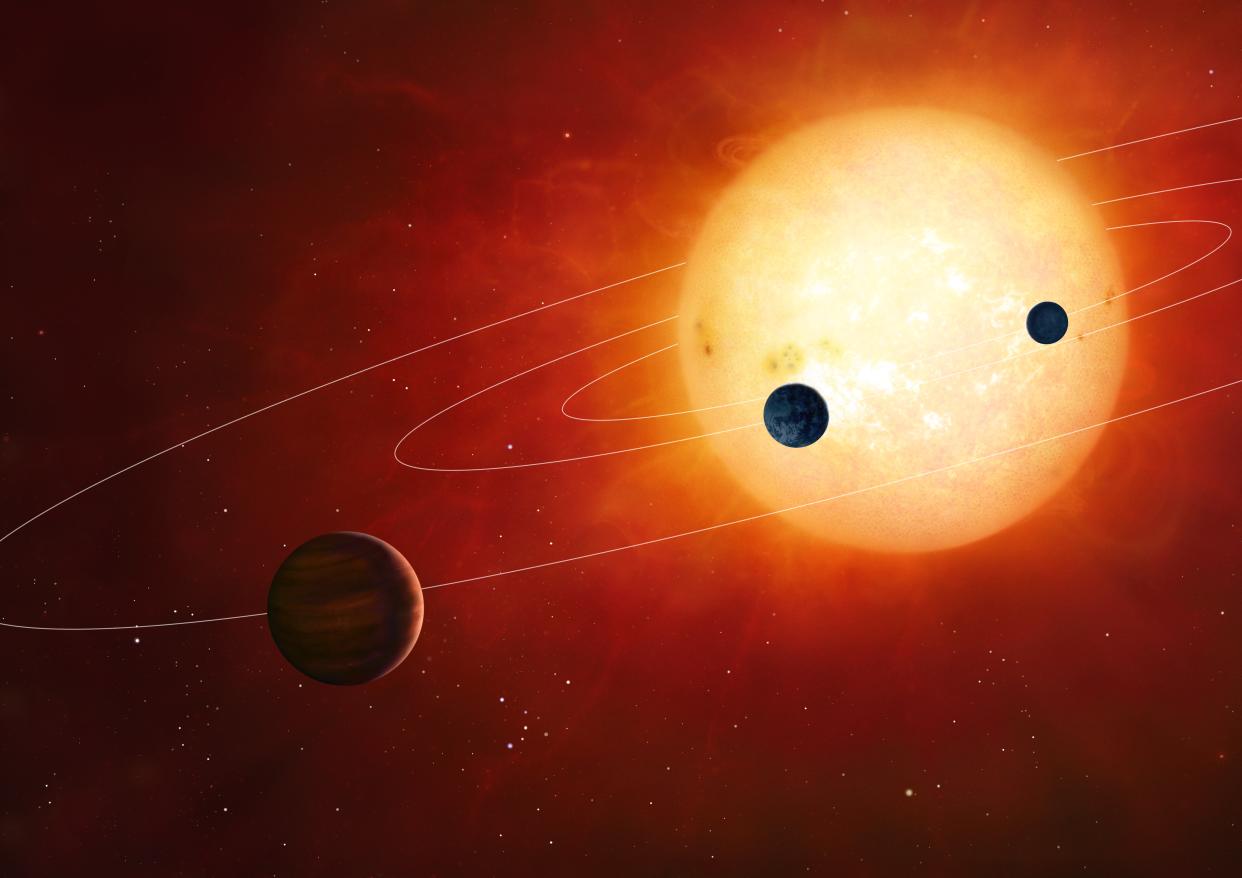 Artwork of a hypothetical planetary system around a sun-like star. The planetary system includes rocky and gaseous planets in tight orbits.