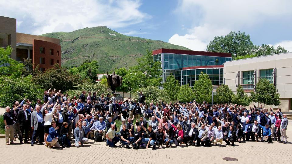 A group of people in front of some buildings