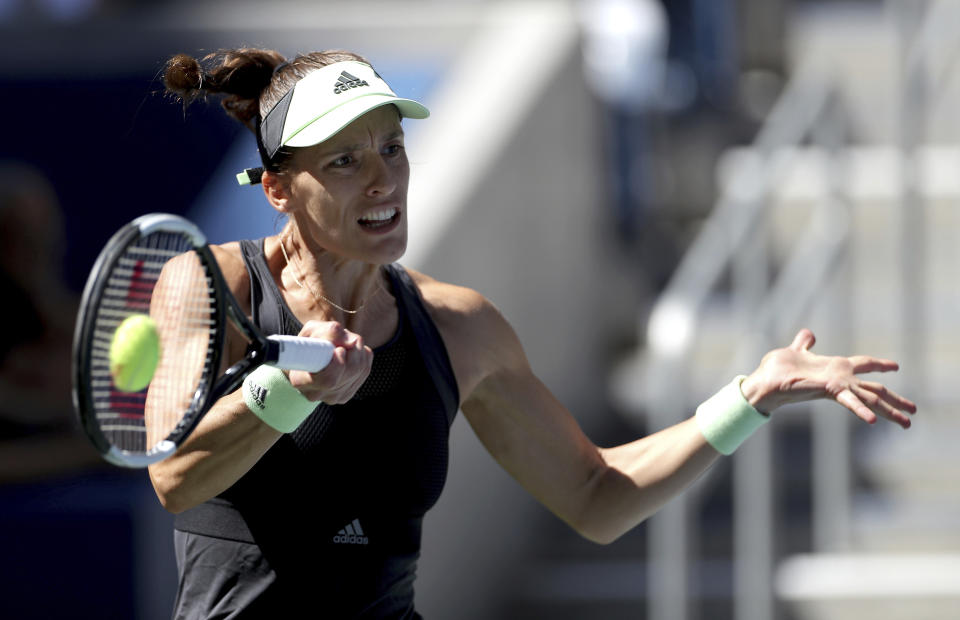 Andrea Petkovic, of Germany, returns a shot to Petra Kvitova, of the Czech Republic, during the second round of the US Open tennis championships Thursday, Aug. 29, 2019, in New York. (AP Photo/Eduardo Munoz Alvarez)